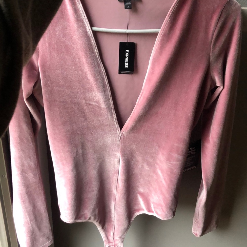 A velvet pink body suit